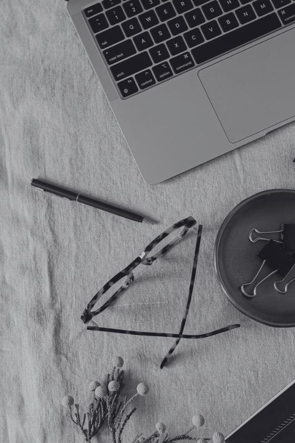 Black and white or MacBook keyboard, glasses and pen - Michael Thacker - Writer