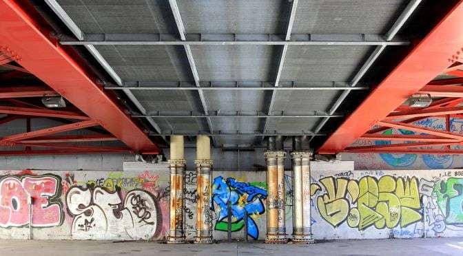 A graffiti covered bridge underside with various colors and style - a jumble of thoughts...